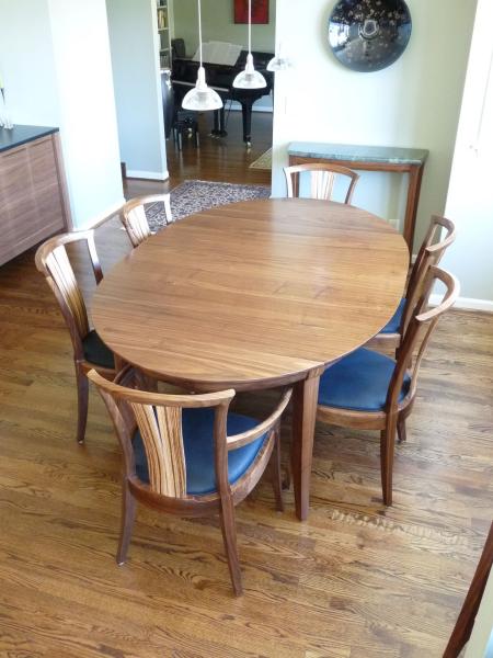 Walnut Medium Grande Laurel Dining Table shown with Neo chairs